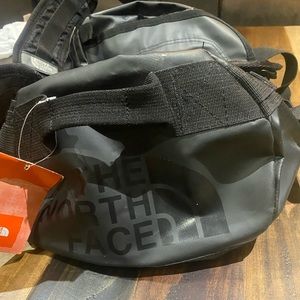 The north face duffle bag pack XS I believe